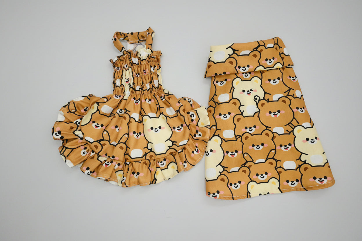 Set of dress and shirt with bear pattern on a white background