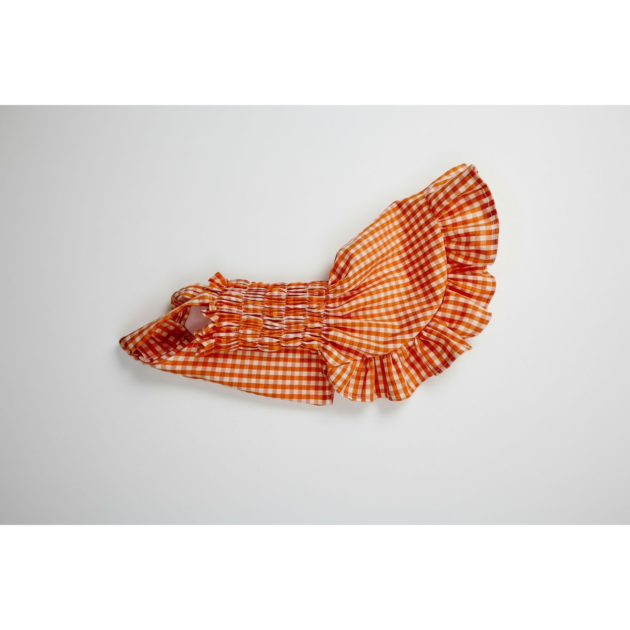 Cute orange gingham elastic shirred summer dog dress.