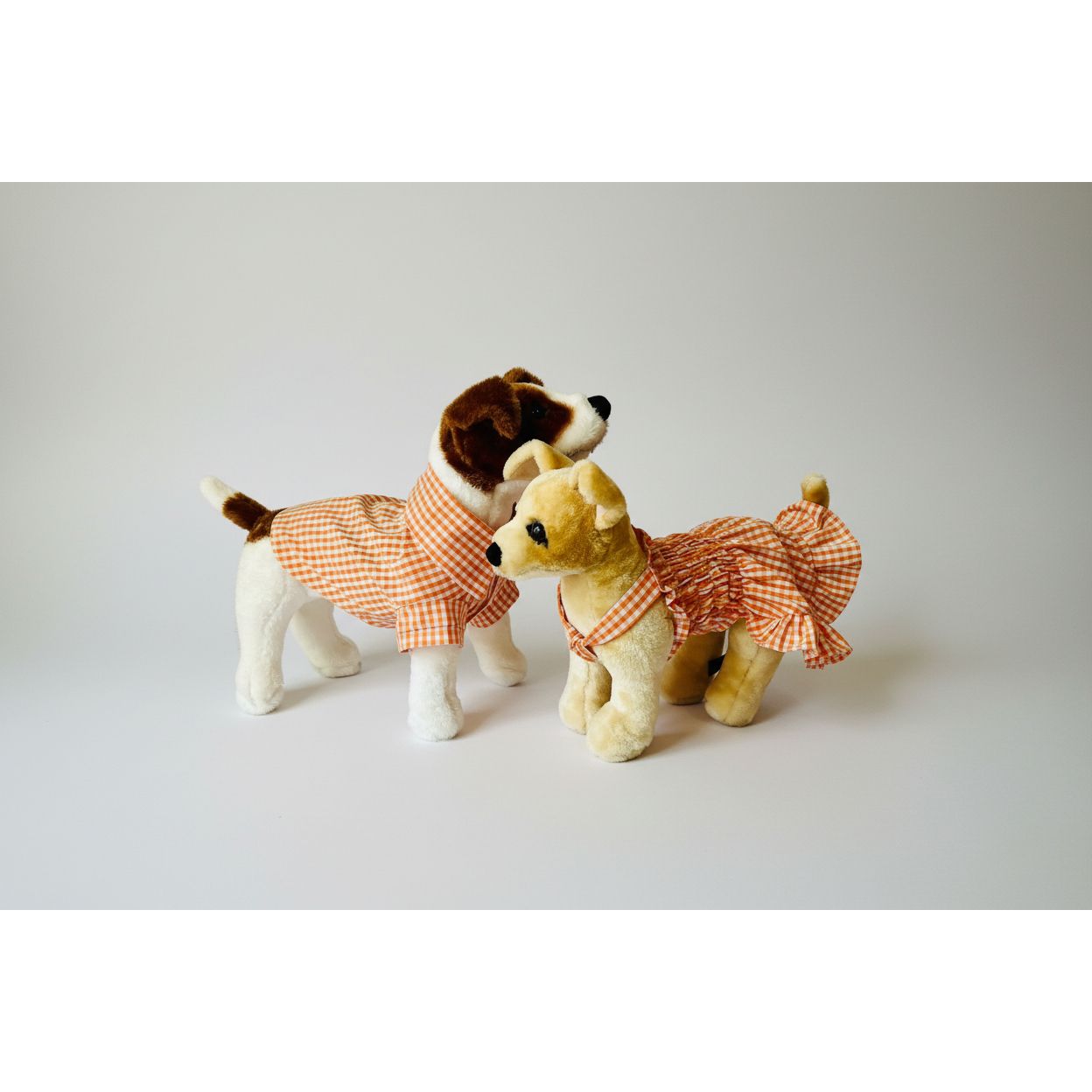 Cute orange gingham elastic shirred summer dog dress.