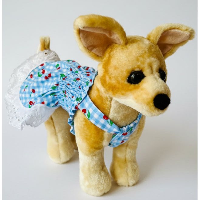 Plush toy dog wearing a diaper on a white background