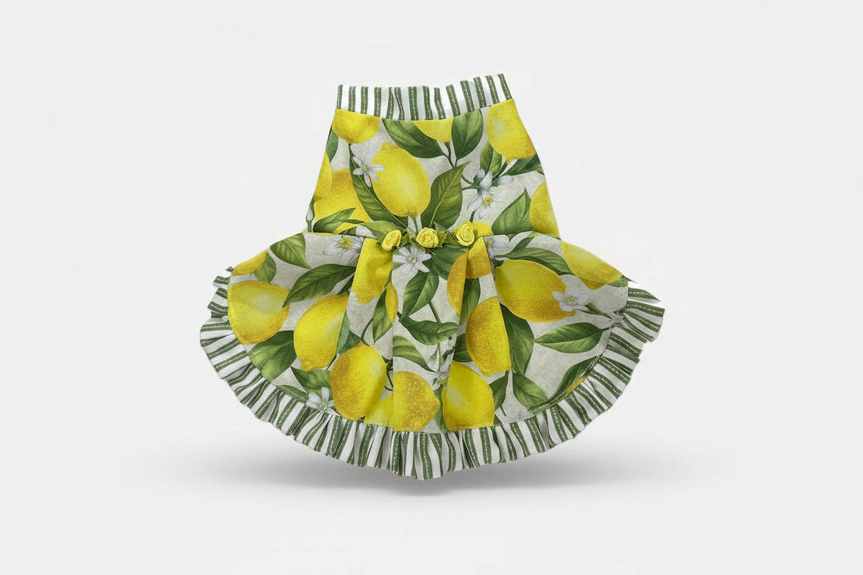 Pet dress with lemon and leaf pattern on a white background