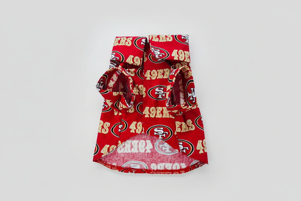 Red dog shirt with San Francisco 49ers logo on a white background