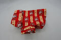 Red fabric dog shirt with San Francisco 49ers logo on a white background
