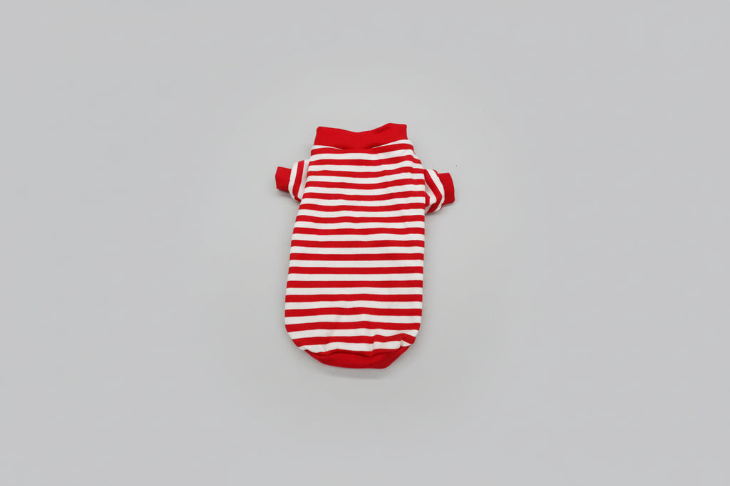 Red and white striped pet sweater on a white surface
