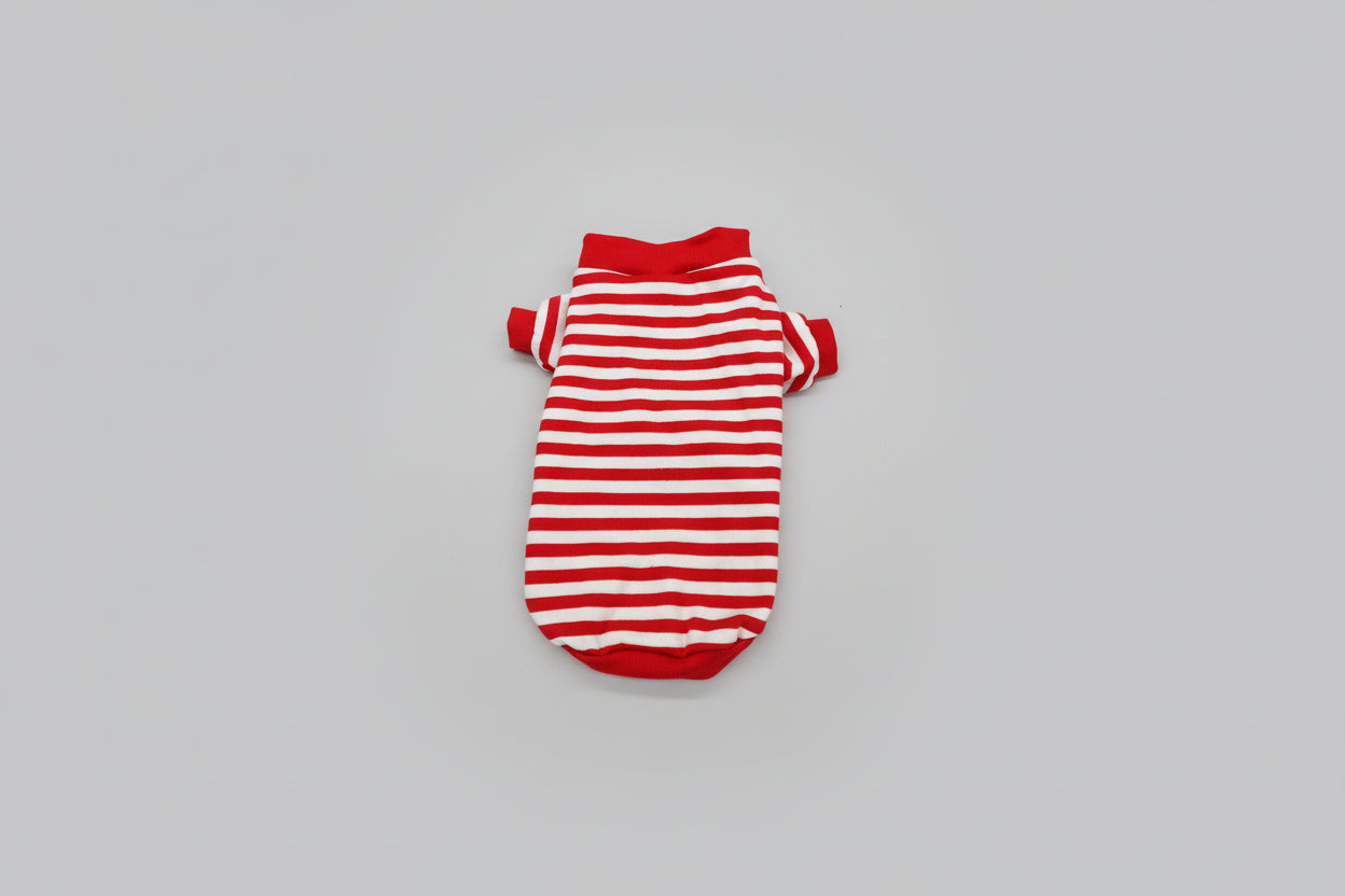 Red and white striped pet sweater on a white surface