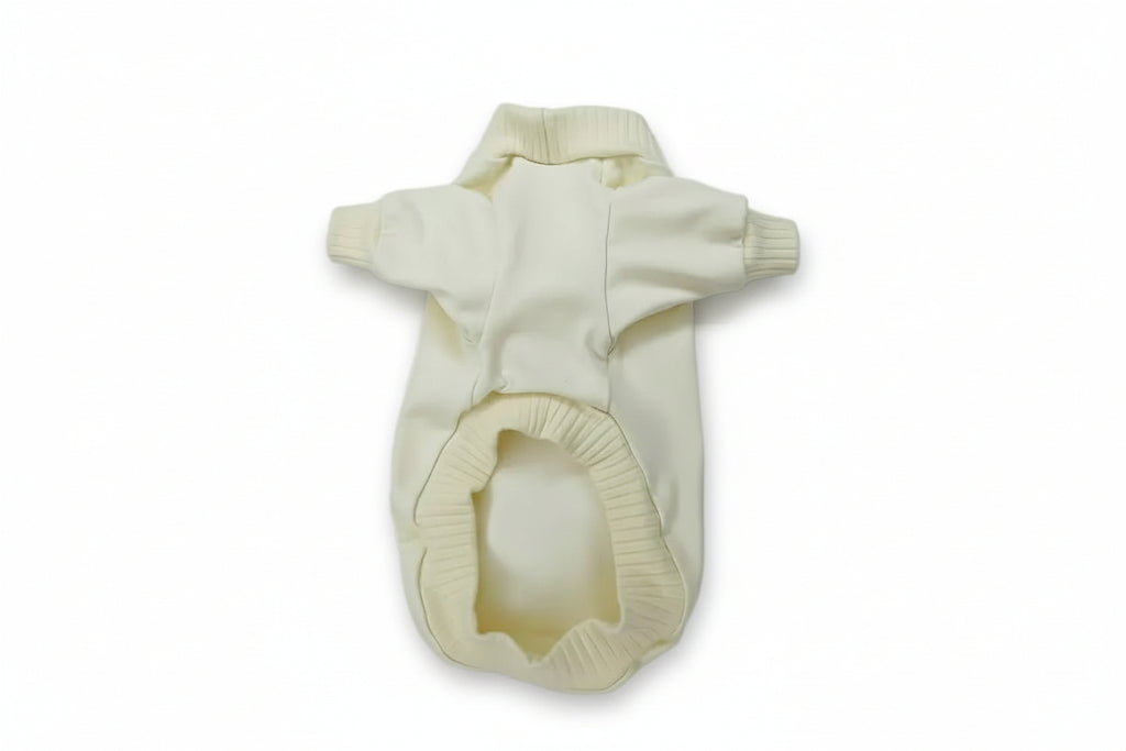 Cream-colored dog sweater on a white background