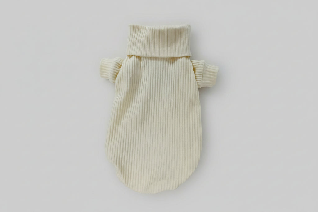 Beige knitted pet sweater on a white background