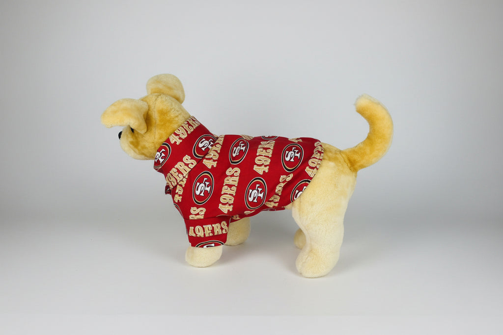 Plush dog toy wearing a red San Francisco 49ers jersey on a white background