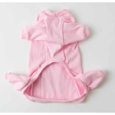 Pink baby onesie on a light-colored surface