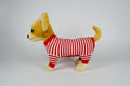 Stuffed dog toy wearing a red and white striped outfit on a white background