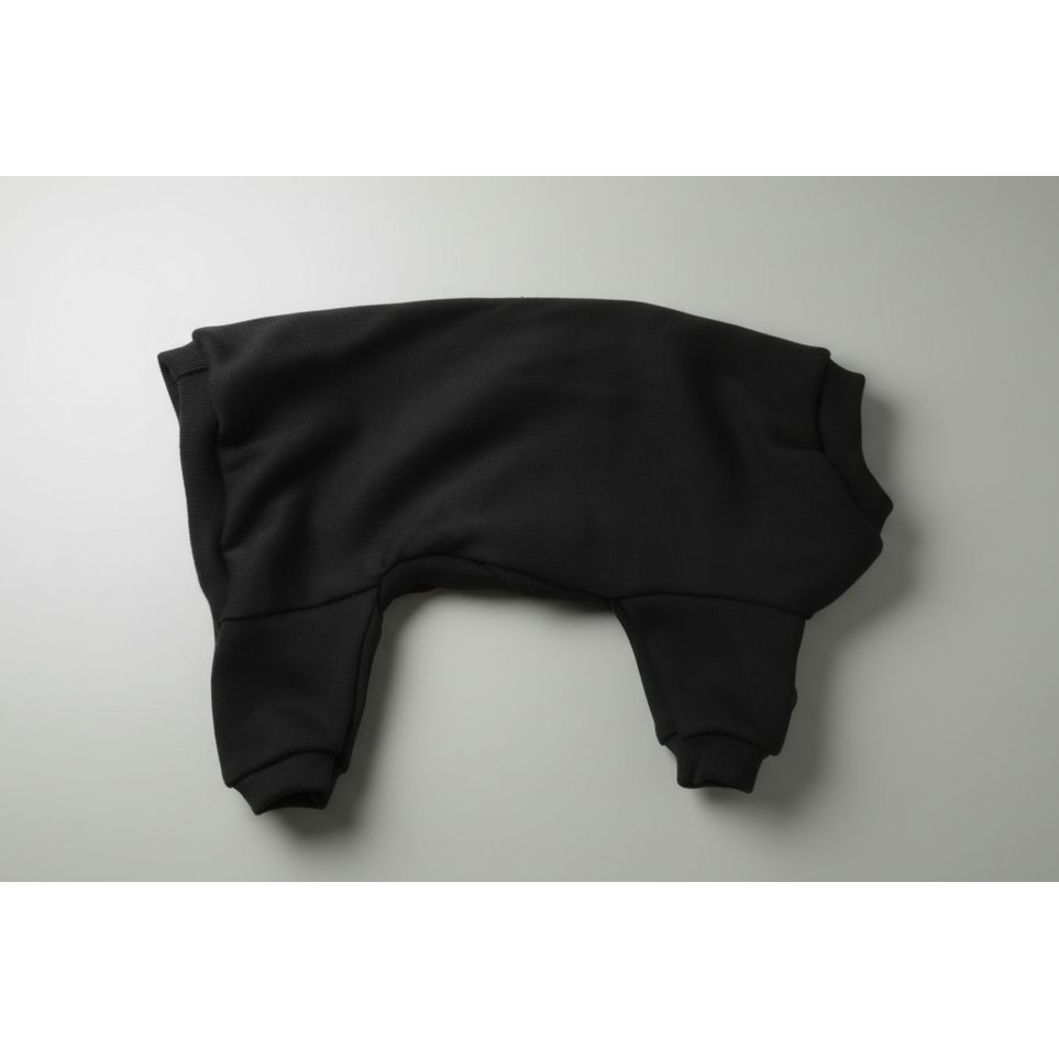 Black long-sleeve dog pajamas on a white bedspread