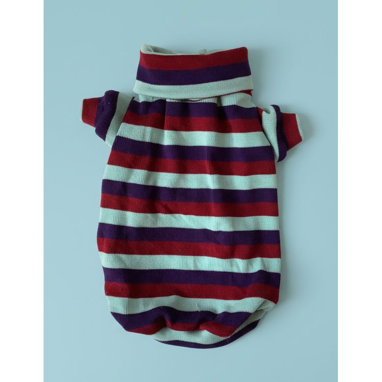 Striped sweater on a white bedspread