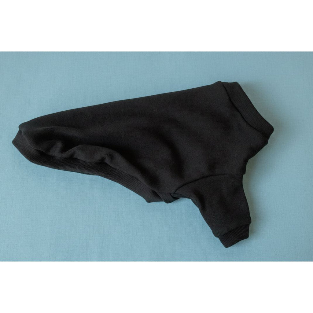 Black hoodie on a white bedspread