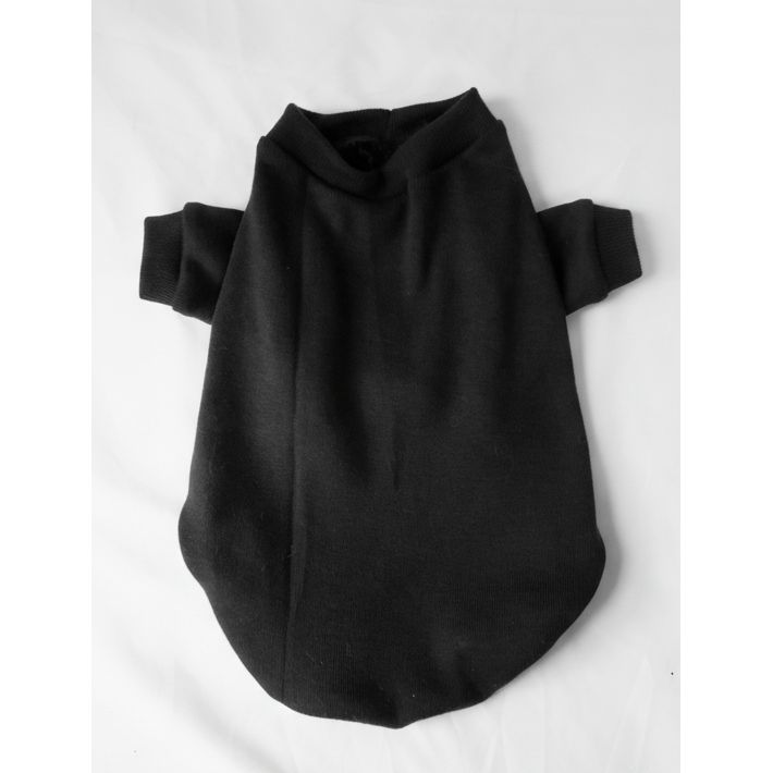 Black dog sweater on a light gray surface