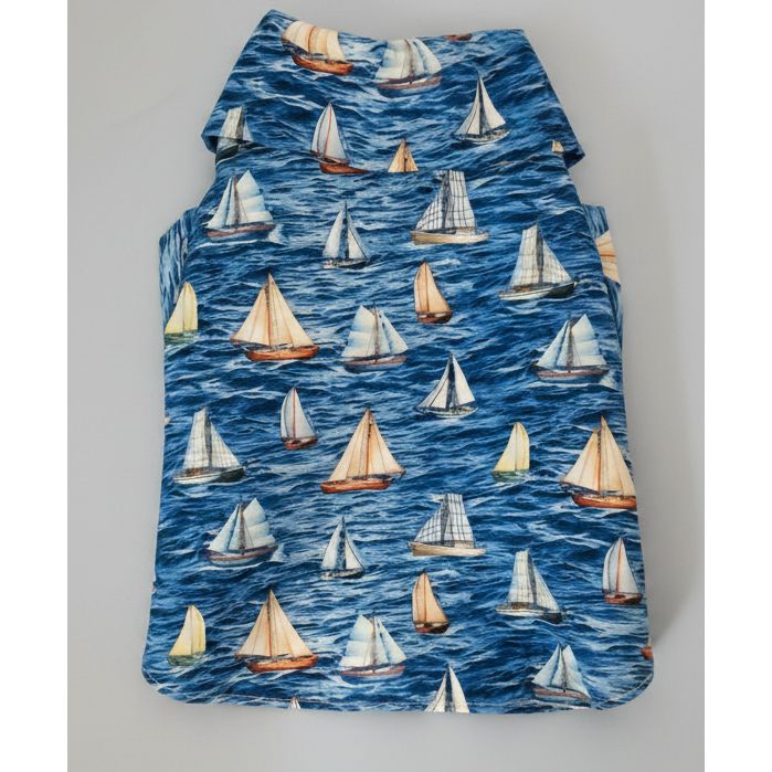 Dog shirt with sailboat pattern on a blue background