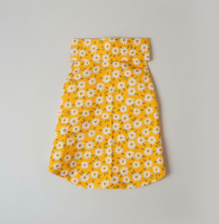 yellow shirt in white surface