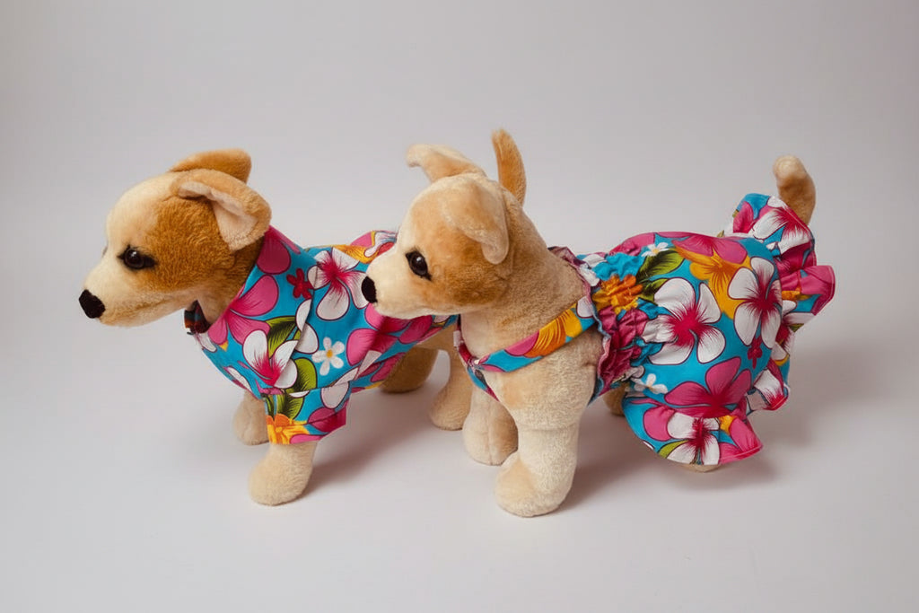 a dog wearing a dress and a dog wearing a shirt