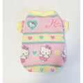 Hello Kitty-themed pink pet sweater on a textured surface