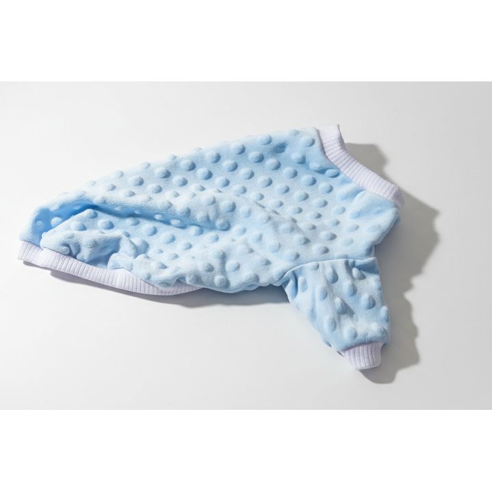 Blue mink dot dog sweater on a beige textured surface