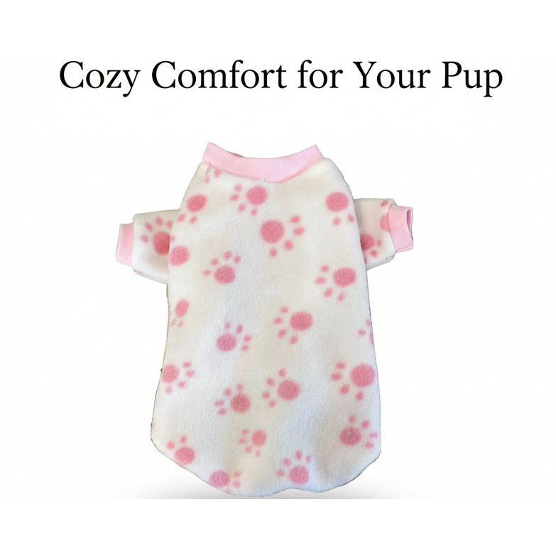 White pet sweater with pink floral pattern on a textured surface