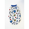Hello Kitty-themed dog sweater on a marble surface
