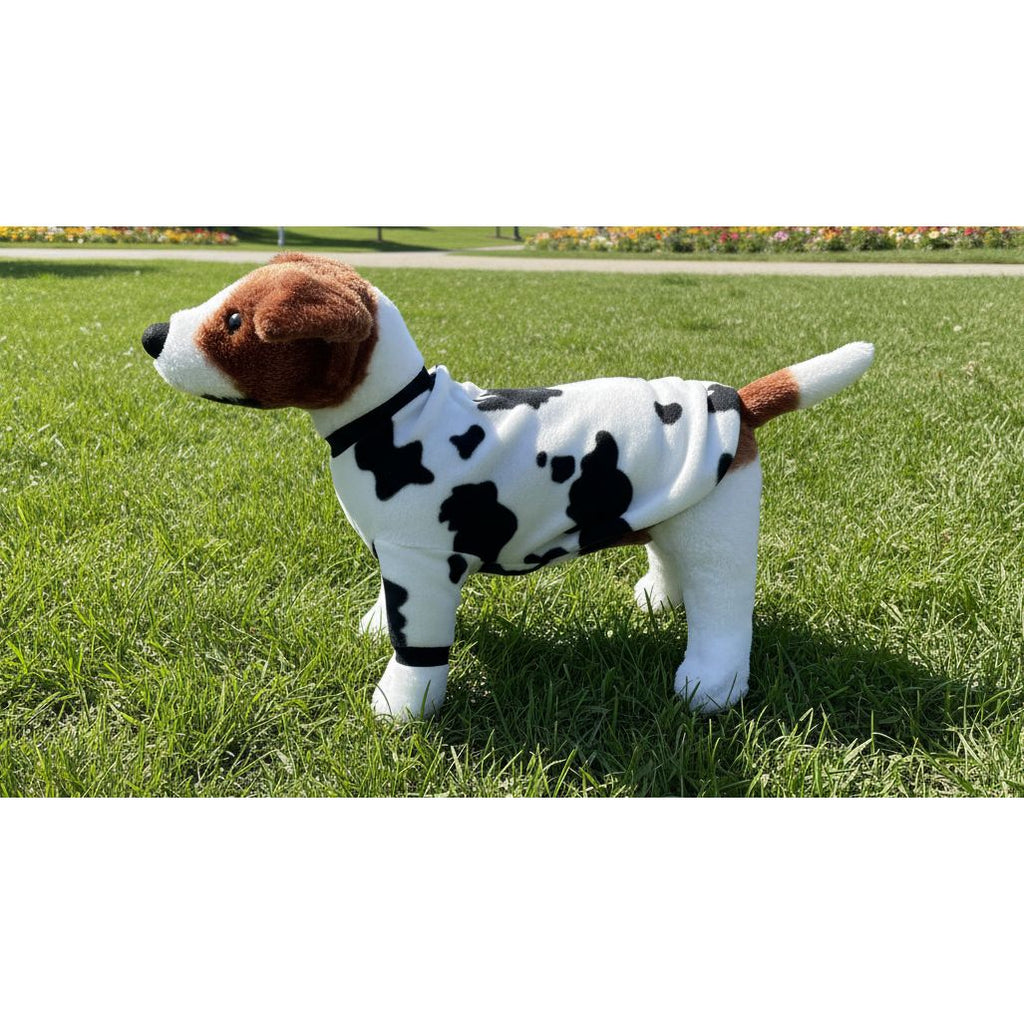 dog wearing a cow print fleece sweater