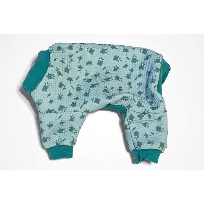 Floral-patterned dog pajamas on a beige surface