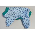 Blue floral-patterned dog pajamas on a beige surface