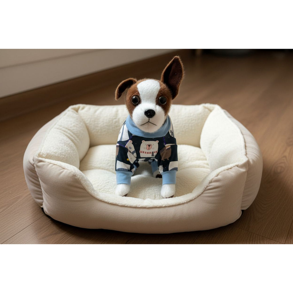 Stuffed dog toy wearing a sweater on a textured beige surface