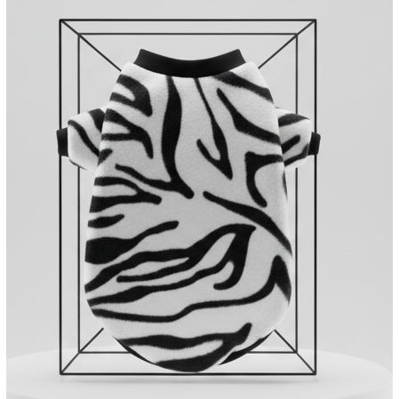 Zebra patterned pet sweater on a wooden surface