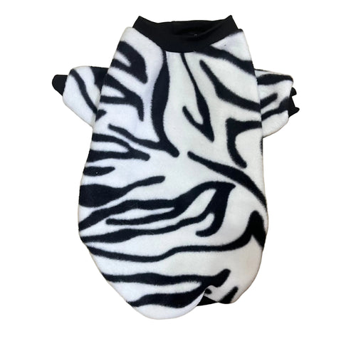 Zebra patterned pet sweater on a wooden surface