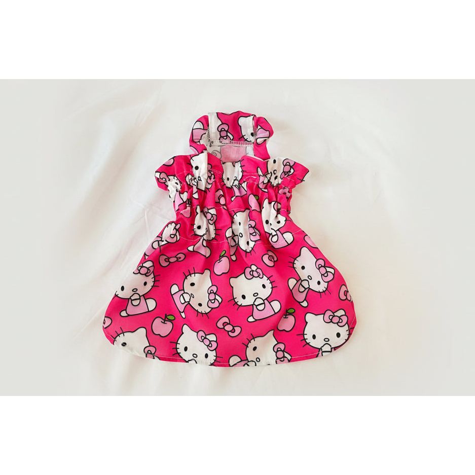 Pink dress with Hello Kitty pattern on a white background