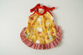 Yellow dress with red checkered skirt and Hello Kitty design on a white background