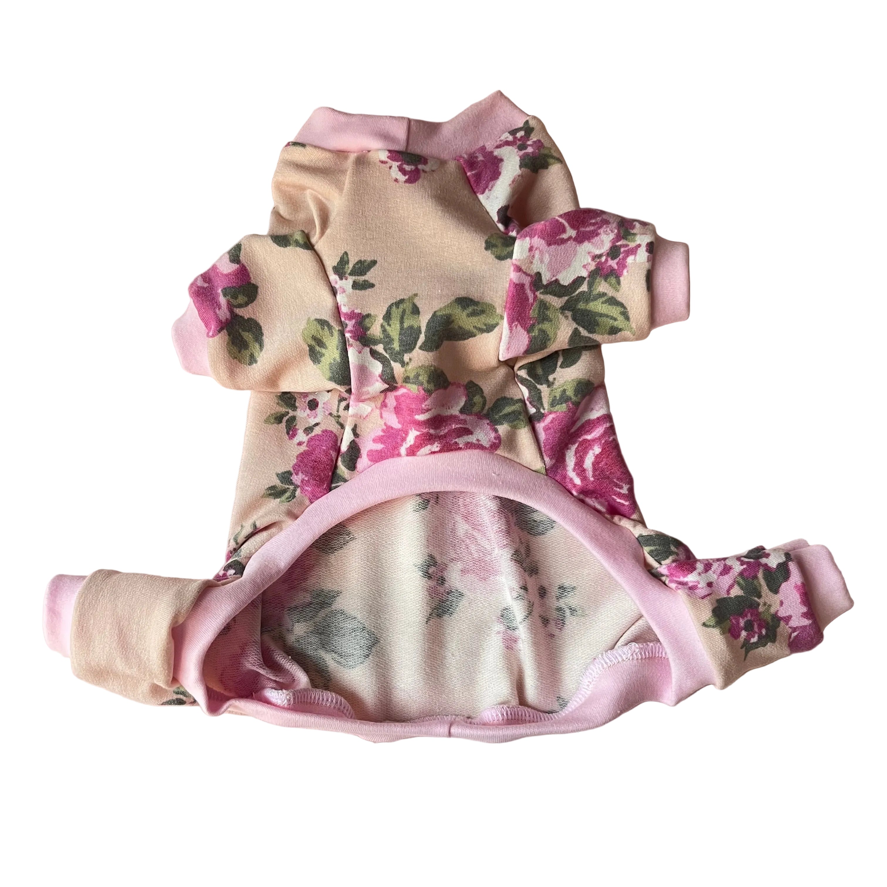 Floral 4 leg pajamas on a beige surface