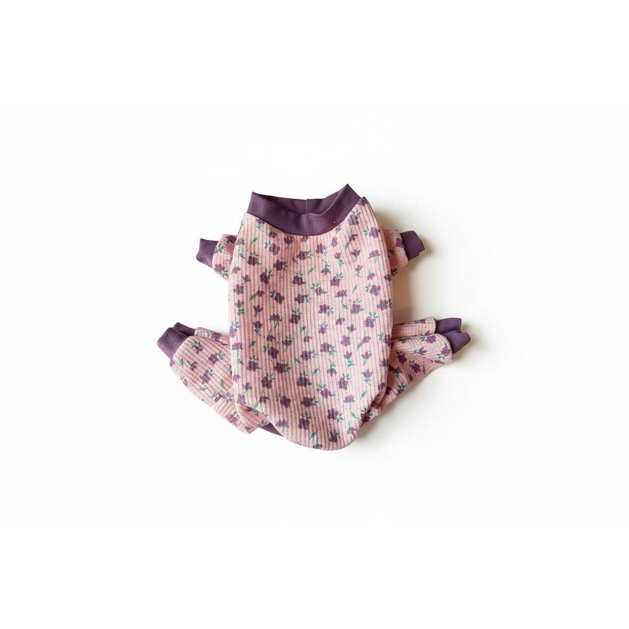 Purple floral print waffle knit dog thermos pajamas with a matching trim.