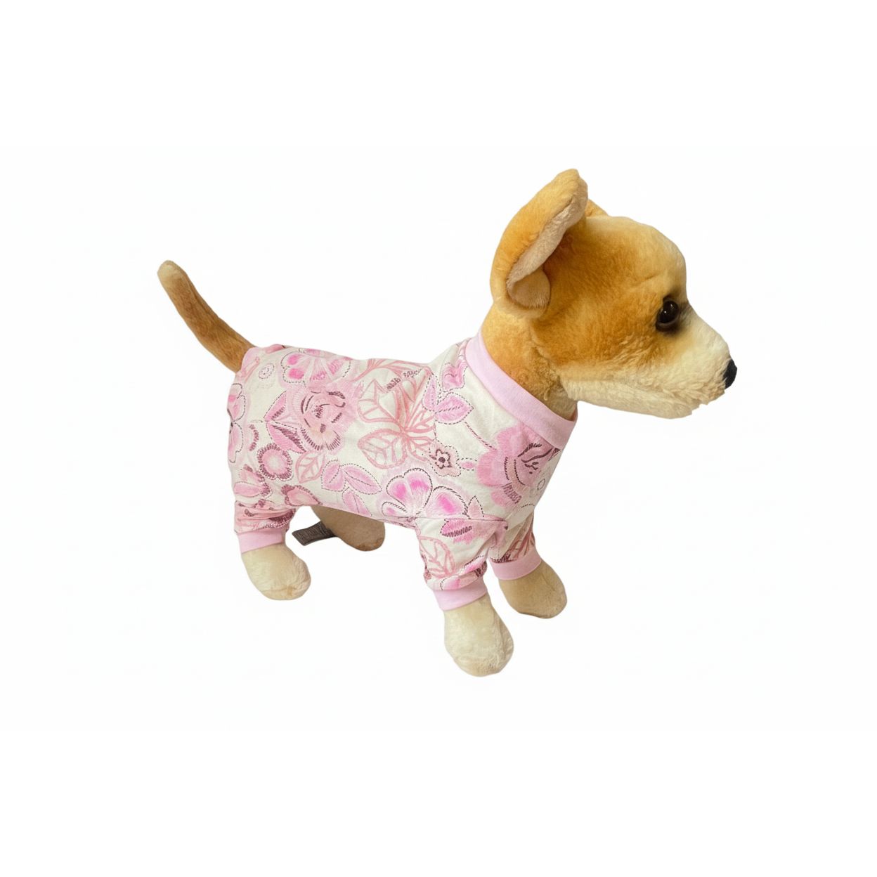 Stuffed dog toy wearing pink floral pajamas on a white background
