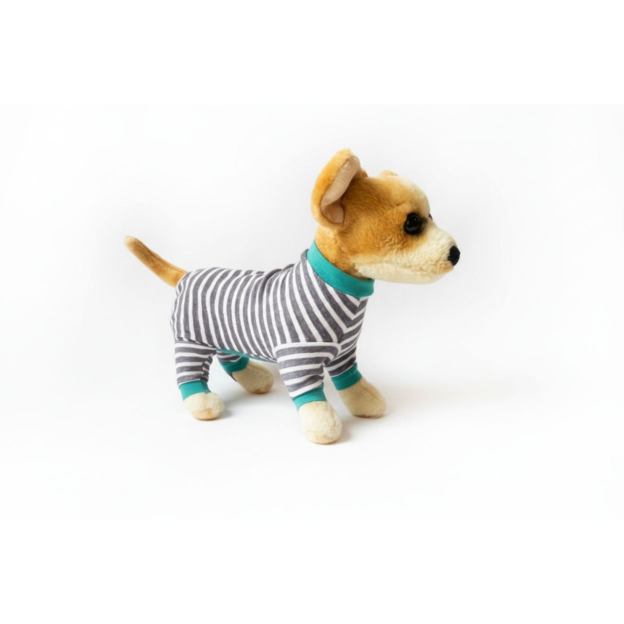 Stuffed dog toy wearing striped pajamas on a white background