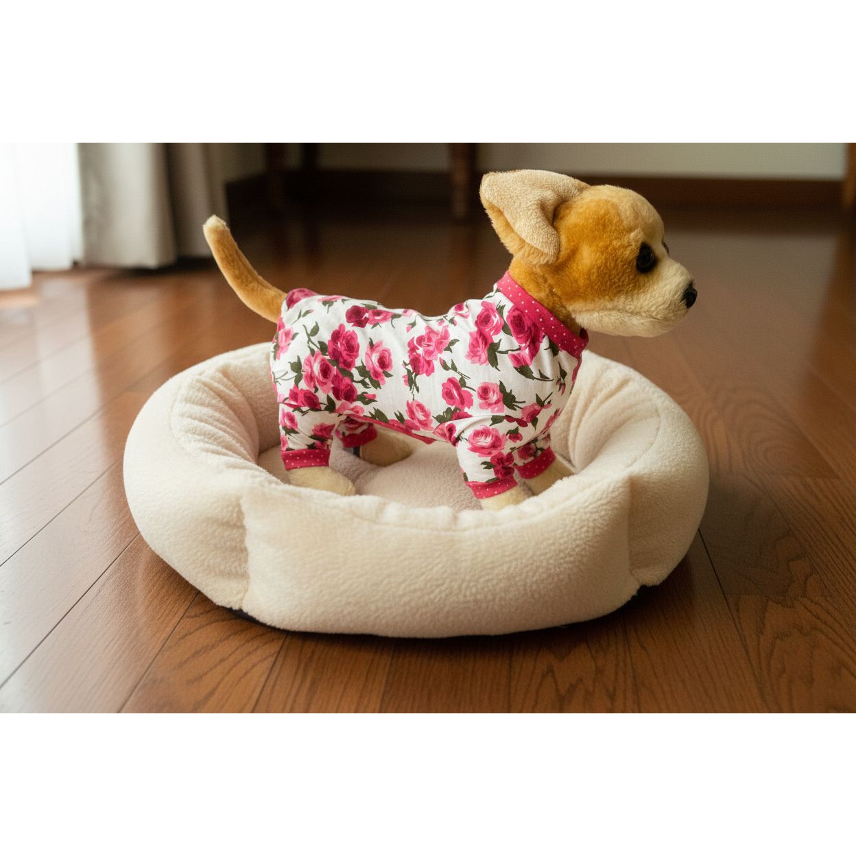 Stuffed dog toy wearing a floral outfit on a white background