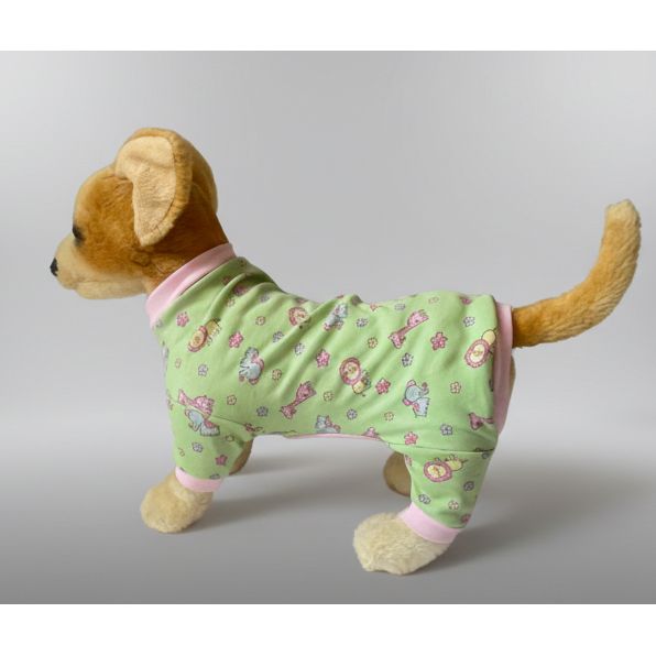 Stuffed dog toy wearing a green outfit with pink trim on a white background